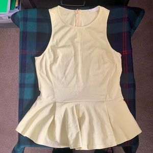 Bright yellow zip up peplum top